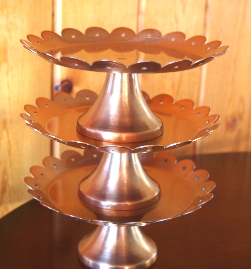 | Copper Cake Stand with Scalloped Edge.