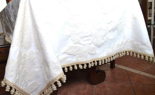 Large ecru linen brocade tablecloth.