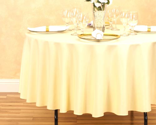 Square tablecloth on round table.