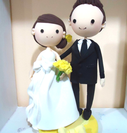Wedding Cake topper Clay Couple in Yellow wedding theme.