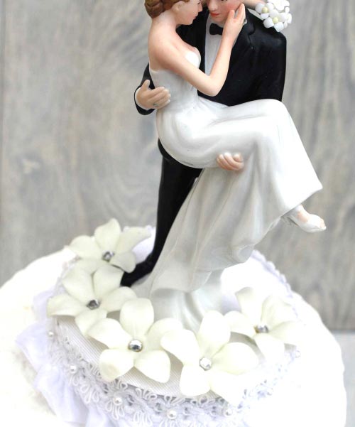 Stephanotis Groom Holding the Bride Wedding Cake Topper.