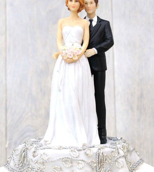 Bride and groom wedding cake toppers.