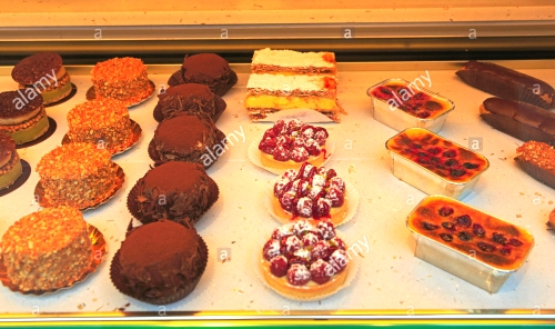 Elegant French pastries for sale in a bakery and.