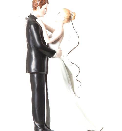 White and Silver Porcelain Bride and Groom Wedding Cake.